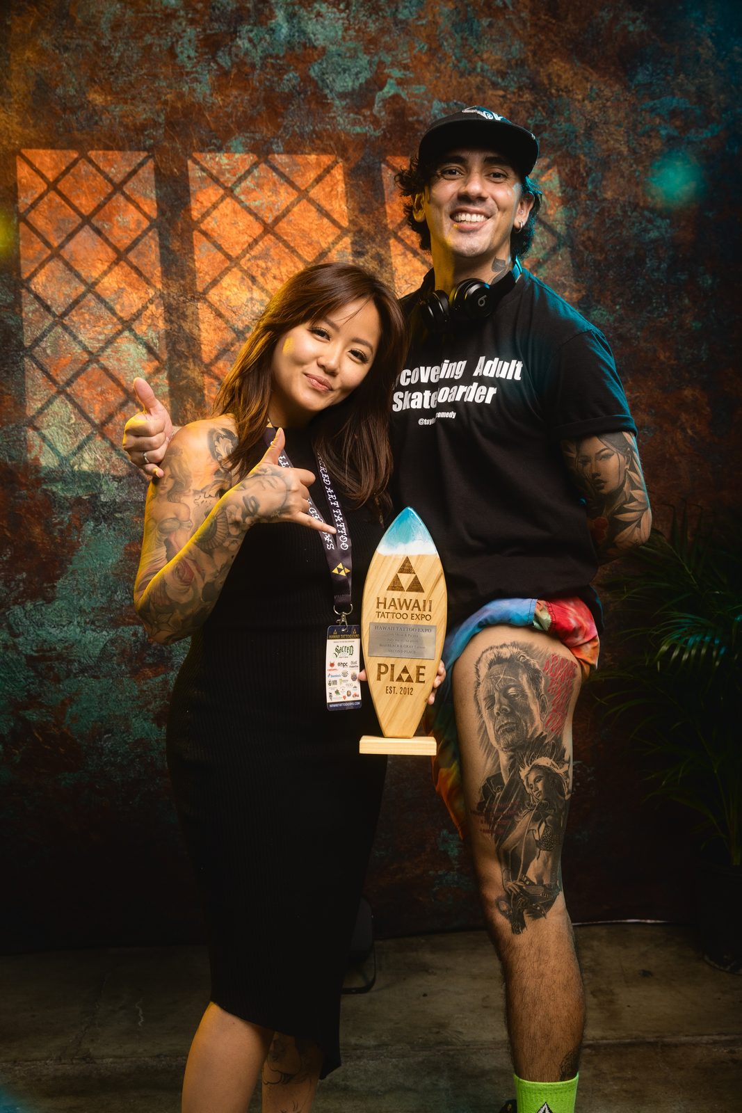 Lynn Hoang with client holding Best Black and Gray award